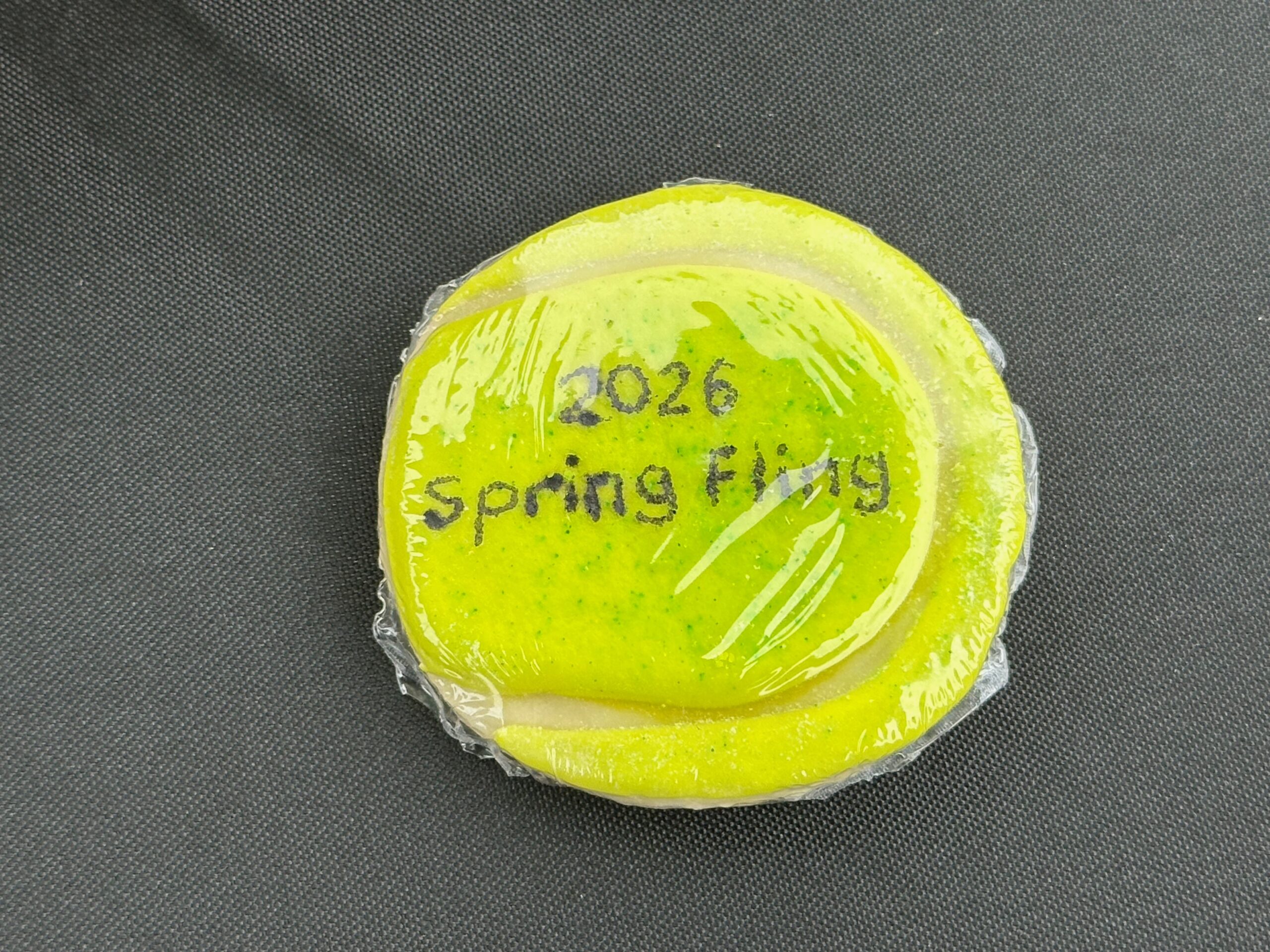Spring Fling 2026 tennis ball graphic
